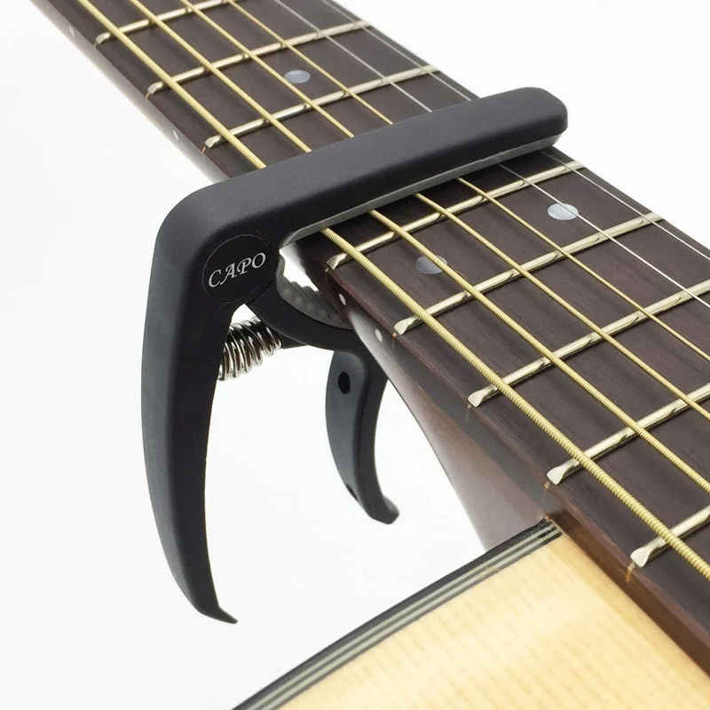 Пластиковый каподастр для 6-ст – обзор и цена Guitar Capo Clip