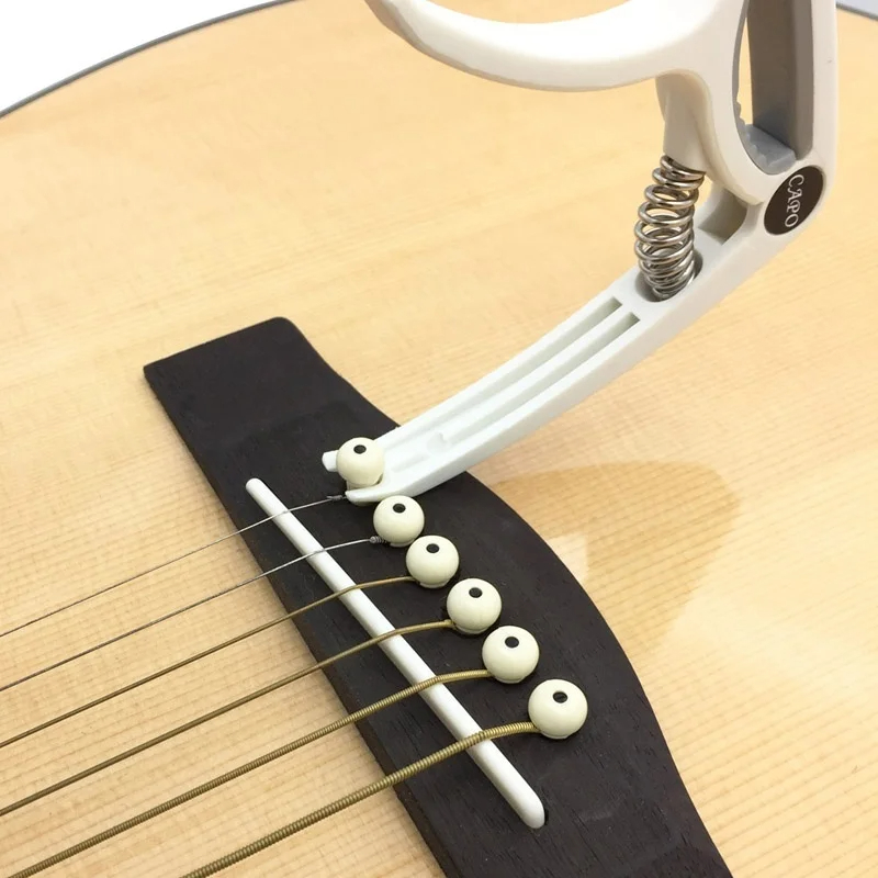 Пластиковый каподастр для 6-ст – обзор и цена Guitar Capo Clip
